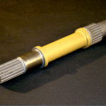 Yellow spindle, one of many aerospace parts made at our machine shop